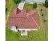 Aerial of house featuring red roof and lush green lawn at 1506 Saint George Pl, Conyers, GA 30012