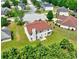 Aerial view of a house featuring well-manicured green lawn, tall chimney, and a small patio at 1506 Saint George Pl, Conyers, GA 30012