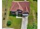 Aerial view of beautiful home with brick facade, 2-car garage, driveway and well-manicured lawn at 1506 Saint George Pl, Conyers, GA 30012