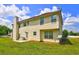 Backyard of home featuring a siding, patio and a satellite dish at 1506 Saint George Pl, Conyers, GA 30012