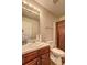 Standard bathroom featuring a vanity with marble countertops and a shower with brown shower curtain at 1506 Saint George Pl, Conyers, GA 30012