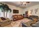 Cozy living room featuring plush sofas, a large TV, and decorative accents at 1506 Saint George Pl, Conyers, GA 30012