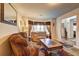Cozy living room featuring comfortable seating and a large mirror, creating an inviting space at 1506 Saint George Pl, Conyers, GA 30012