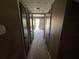 Hallway featuring doors, carpet, and access to other parts of the home at 2572 Stratford Ln, Morrow, GA 30260