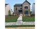 Two-story home featuring a well-kept lawn, neutral siding, and an inviting front entrance at 3472 Adler Trl, Buford, GA 30519