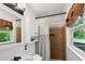 Cozy full bathroom with shiplap, shower, updated fixtures, and burlap accents at 4124 Dunnington Dr, Marietta, GA 30062