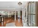 View of the entryway featuring beautiful hardwood floors and a glimpse of the kitchen and dining area at 4124 Dunnington Dr, Marietta, GA 30062