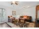 Comfortable living room with a brown couch, decorative rug and modern lighting creating a cozy atmosphere at 4124 Dunnington Dr, Marietta, GA 30062
