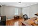Bright office with hardwood floors, desk, storage and shuttered windows at 4124 Dunnington Dr, Marietta, GA 30062