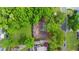 Aerial view of the house showing the roof and the surrounding lush green trees at 5742 Harbor Dr, Buford, GA 30518