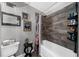 This bathroom features a toilet, a shower, and dark accents at 5742 Harbor Dr, Buford, GA 30518