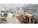 Eat-in kitchen featuring an island, stainless appliances, a dining area, and tile floors at 5742 Harbor Dr, Buford, GA 30518