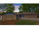 Attractive single story home with stone and blue siding and a well maintained front lawn at 5742 Harbor Dr, Buford, GA 30518