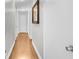 Hallway with hardwood floors and white walls at 5742 Harbor Dr, Buford, GA 30518
