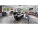 Large, well-lit living room with a comfortable seating area, modern decor, and unique artwork at 5742 Harbor Dr, Buford, GA 30518