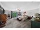 Large main bedroom featuring a ceiling fan, a sliding glass door leading to the backyard, and neutral decor at 5742 Harbor Dr, Buford, GA 30518