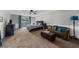 Spacious main bedroom suite with sitting area, carpet, neutral colors, and backyard access at 5742 Harbor Dr, Buford, GA 30518
