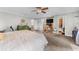 Spacious main bedroom featuring neutral walls, carpet, and a ceiling fan for comfort and style at 5742 Harbor Dr, Buford, GA 30518
