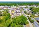 Scenic aerial view of a charming small town with tree-lined streets and traditional buildings, showcasing its peaceful community setting at 8612 Campbellton St, Douglasville, GA 30134