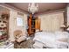 Luxurious bedroom showcasing ornate detailing, ample natural light, and elegant furnishings with chandelier at 8612 Campbellton St, Douglasville, GA 30134