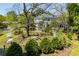 Expansive home exterior surrounded by lush greenery, mature trees, and manicured grounds at 8612 Campbellton St, Douglasville, GA 30134