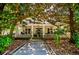 Charming two-story home featuring a classic front porch with white pillars, fans, and decorative railings at 8612 Campbellton St, Douglasville, GA 30134