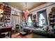 Cozy living room featuring bookshelves, vintage furniture, and unique decor at 8612 Campbellton St, Douglasville, GA 30134