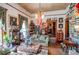 Traditional living room features bookshelves, antique furniture, and vintage decorations at 8612 Campbellton St, Douglasville, GA 30134