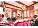 Cozy living room featuring ornate wallpaper, patterned curtains, and classic furniture at 8612 Campbellton St, Douglasville, GA 30134