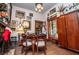 Ornate study featuring dark wood furniture, vintage decor, and unique artwork at 8612 Campbellton St, Douglasville, GA 30134