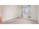 Bright bedroom with neutral carpet, large window, and modern curtains, offering serene city views at 1101 Juniper Ne St # 919, Atlanta, GA 30309