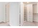 Walk-in closet with custom shelving and drawers at 1101 Juniper Ne St # 919, Atlanta, GA 30309