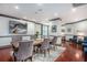 The dining room features modern lighting, dark wood floors, and elegant seating for formal dining at 1101 Juniper Ne St # 919, Atlanta, GA 30309
