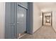 This hallway features neutral carpeting, and trim, providing a well-lit and inviting path through the home at 1101 Juniper Ne St # 919, Atlanta, GA 30309