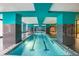 The indoor pool features a sleek design with blue columns, providing a luxurious swimming experience year-round at 1101 Juniper Ne St # 919, Atlanta, GA 30309