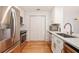 Galley kitchen with stainless steel appliances and hardwood floors at 1101 Juniper Ne St # 919, Atlanta, GA 30309