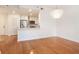 Open concept living room and kitchen with hardwood floors and modern lighting at 1101 Juniper Ne St # 919, Atlanta, GA 30309