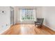 Living room with hardwood floors and view of city through window at 1101 Juniper Ne St # 919, Atlanta, GA 30309