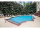 Relaxing outdoor pool with lounge chairs, surrounded by lush trees and greenery, perfect for residents at 1101 Juniper Ne St # 919, Atlanta, GA 30309