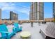 Enjoy city views from this rooftop deck, with seating, lounge chairs and greenery, perfect for relaxation and socializing at 1101 Juniper Ne St # 919, Atlanta, GA 30309