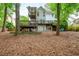 Spacious backyard with multi-level deck, surrounded by mature trees providing privacy and shade at 1161 Arborhill Dr, Woodstock, GA 30189