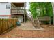 Backyard with a wooden fence, patio, seating, and a tiered deck, perfect for outdoor activities at 1161 Arborhill Dr, Woodstock, GA 30189