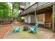 Backyard patio with fire pit and seating under a deck is ideal for outdoor entertaining at 1161 Arborhill Dr, Woodstock, GA 30189