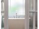 Bathtub in well lit bathroom features a large window, perfect for soaking in natural light at 1161 Arborhill Dr, Woodstock, GA 30189
