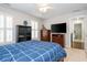 Spacious bedroom with a wood bed frame, plush carpet, and window with shutters at 1161 Arborhill Dr, Woodstock, GA 30189
