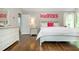 Cozy bedroom with hardwood floors, a large bed, and ample closet space at 1161 Arborhill Dr, Woodstock, GA 30189