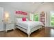 Bright bedroom with large windows, hardwood floors, and stylish decor at 1161 Arborhill Dr, Woodstock, GA 30189