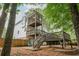 Beautiful two-story home with multiple decks and a spacious backyard surrounded by mature trees at 1161 Arborhill Dr, Woodstock, GA 30189