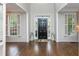 Bright foyer featuring hardwood floors and windows, creating an inviting entrance at 1161 Arborhill Dr, Woodstock, GA 30189