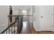 Open hallway featuring hardwood floors, railings, neutral colors, and natural light at 1161 Arborhill Dr, Woodstock, GA 30189